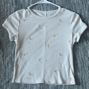 White crop top with yellow floral flowers.